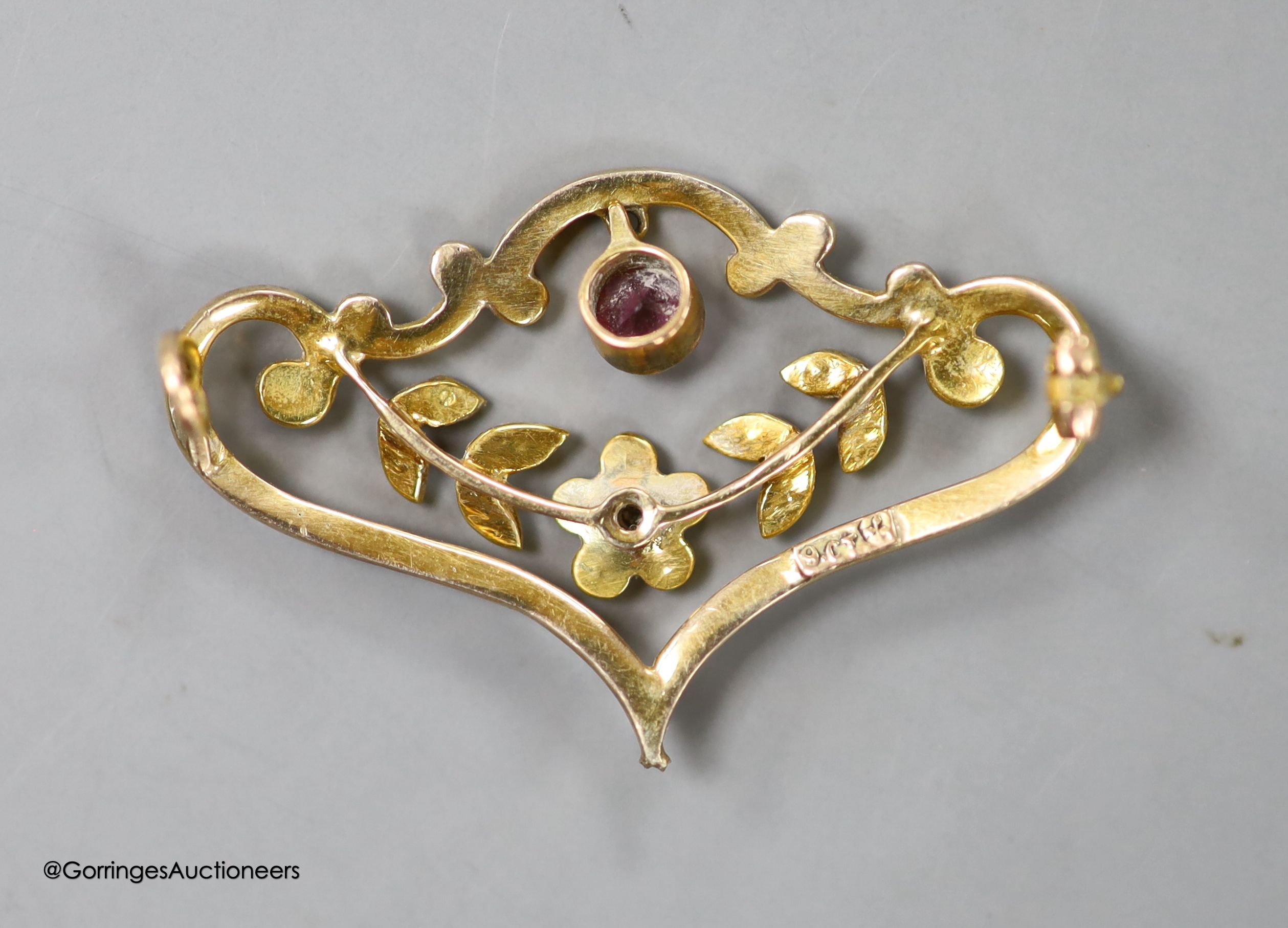 An Edwardian 9ct, enamel, seed pearl and gem set drop scroll brooch, 33mm, ross weight 2.6 grams(a.f.).